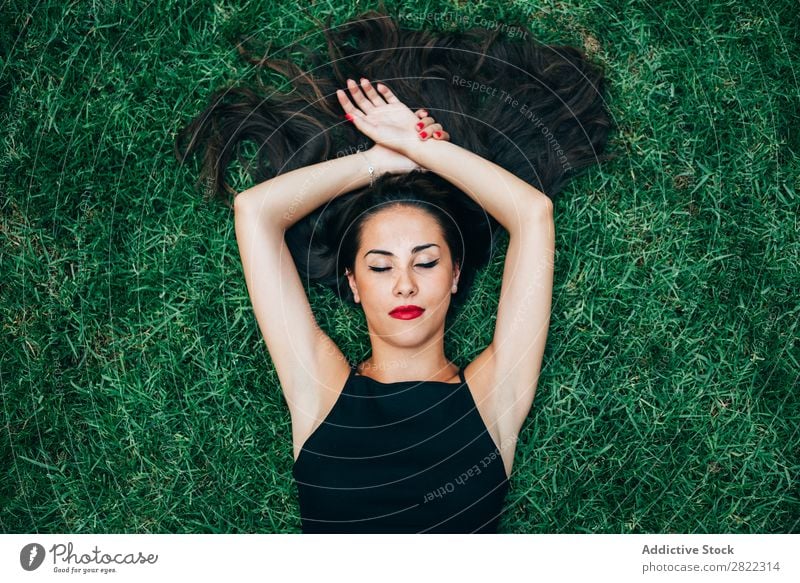 Cheerful brunette woman lying in grass Woman pretty Youth (Young adults) Beautiful Lie (Untruth) Grass Nature Brunette Attractive Human being Beauty Photography