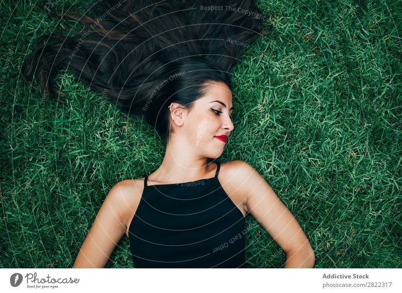 Cheerful brunette woman lying in grass Woman pretty Youth (Young adults) Beautiful Lie (Untruth) Grass Nature Brunette Attractive Human being Beauty Photography