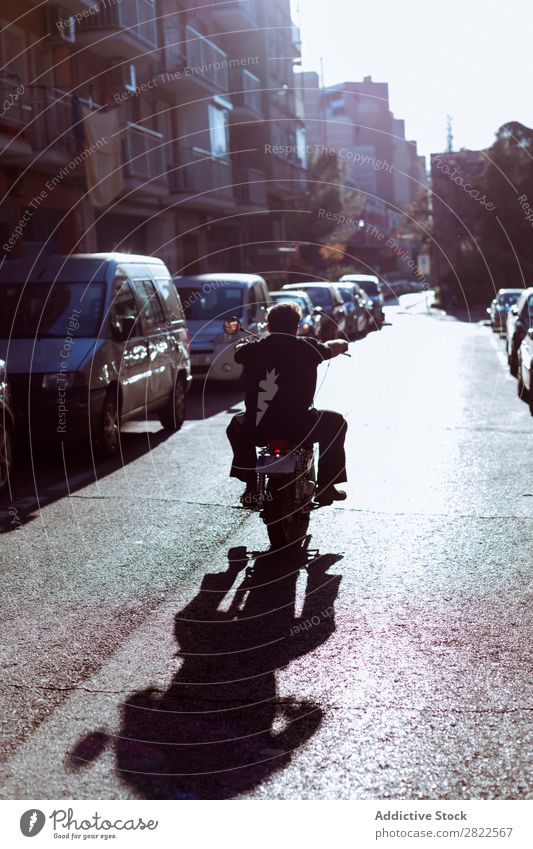 Biker riding on street Motorcycling Human being Ride Man Motorcycle Street Workshop Parked Engines Transport Vehicle custom Professional Machinery