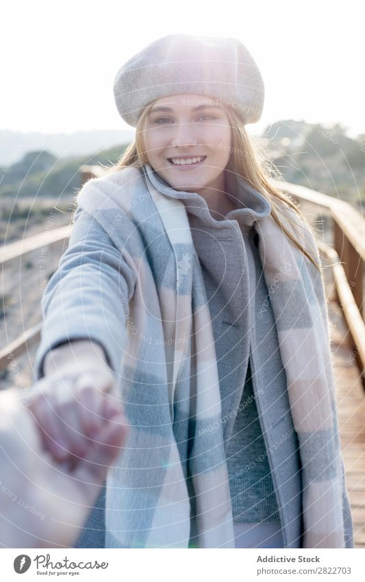 Stylish woman holding hand of photographer Woman pretty Youth (Young adults) Beautiful Attractive boardwalk Corridor Wood Nature Style Beret follow me Gesture