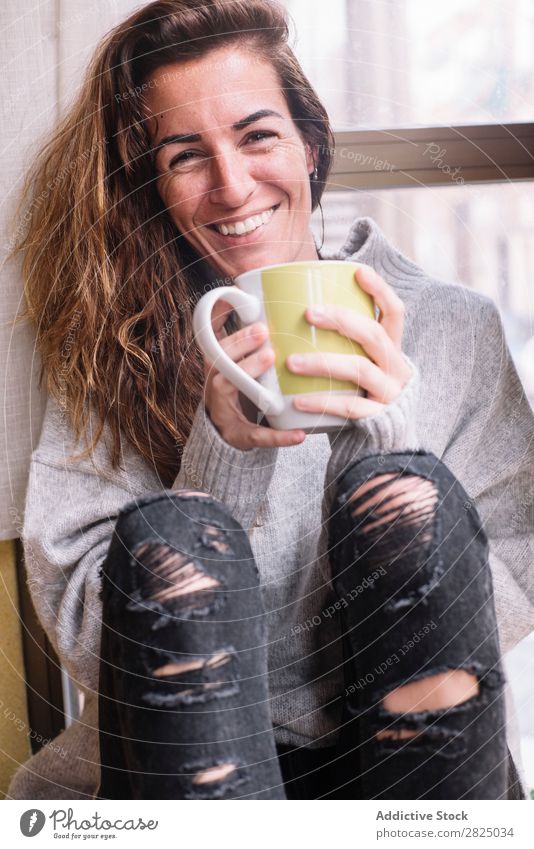 Cheerful woman relaxing with cup Woman Home Relaxation Lifestyle Cup Mug Drinking Hot Smiling Coffee Tea Beautiful Room Human being Easygoing Adults