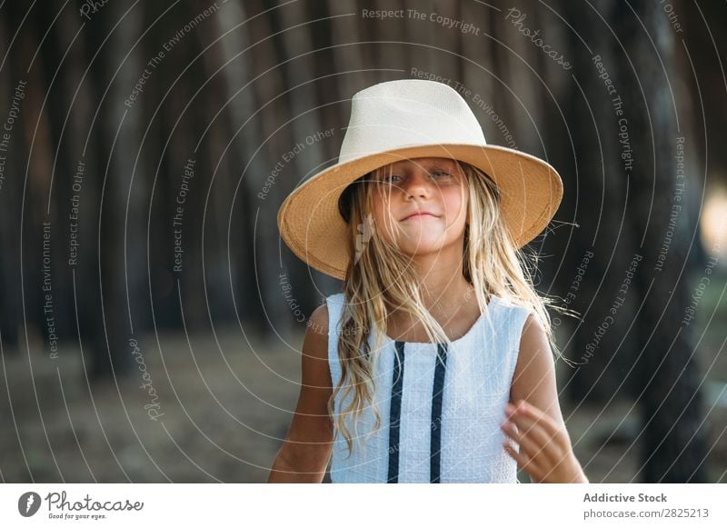 Smiling kid in hat outside Child Cheerful Playful Portrait photograph Happiness Posture Style Hat Self-confident Cowboy Laughter Girl Delightful Summer