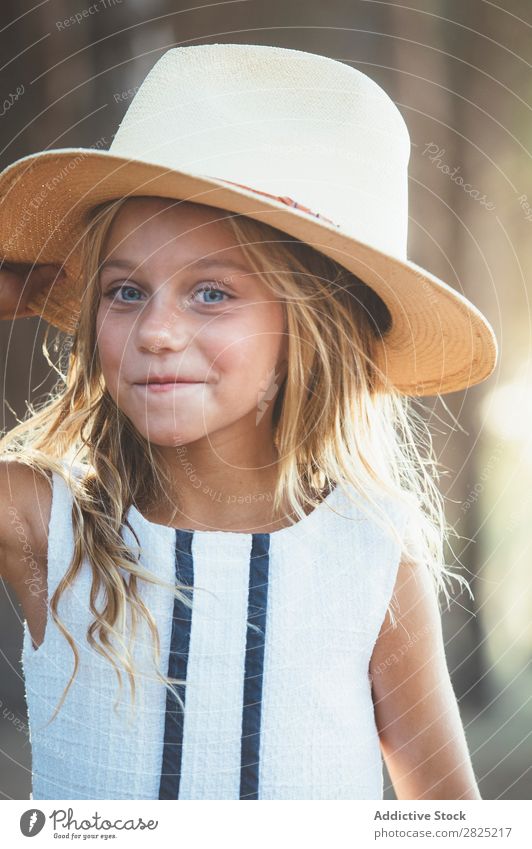 Smiling kid in hat outside Child Cheerful Playful Portrait photograph Happiness Posture Style Hat Self-confident Cowboy Laughter Girl Delightful Summer