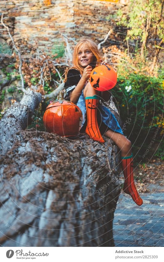Expressive kid in costume posing on tree Girl Costume Nature Hallowe'en Playful Posture Feasts & Celebrations Outstretched Expression Tree trunk Scream Clothing