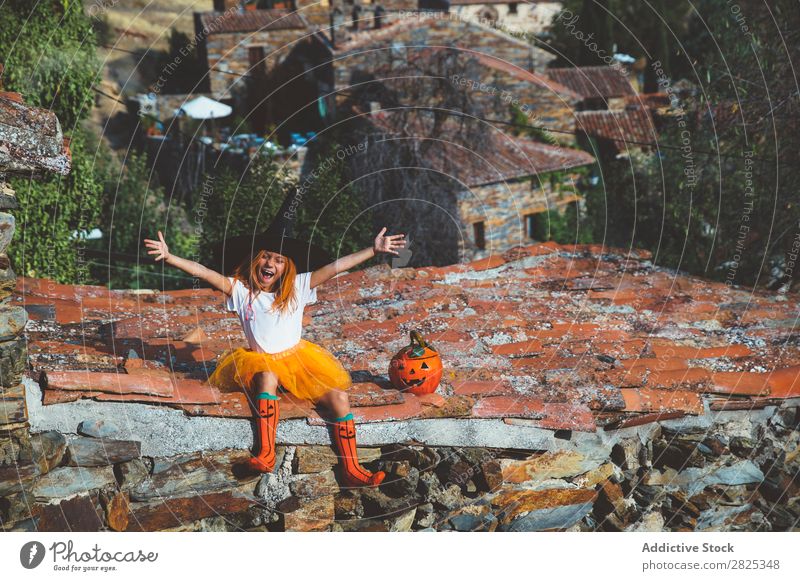Girl in costume posing on roof Costume Hallowe'en Playful rooftop Feasts & Celebrations Posture Intellect Tradition Expression Seasons Happiness Guest Street