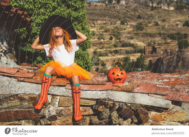 Girl in costume posing on roof Costume Hallowe'en Playful rooftop Feasts & Celebrations Posture Intellect Tradition Expression Seasons Guest Street Infancy