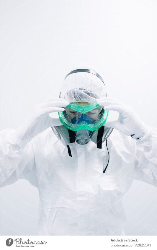 Scientist putting on protective mask Laboratory Research Chemistry Dressing Mask Protective Cooking experiment Science & Research Medication scientific