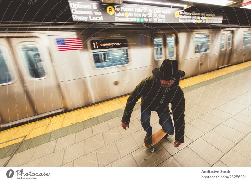 Man on skateboard in subway riding Underground Skateboard Copy Space Cool (slang) Self-confident Hat bearded Earnest Brutal Beard Human being City Hipster