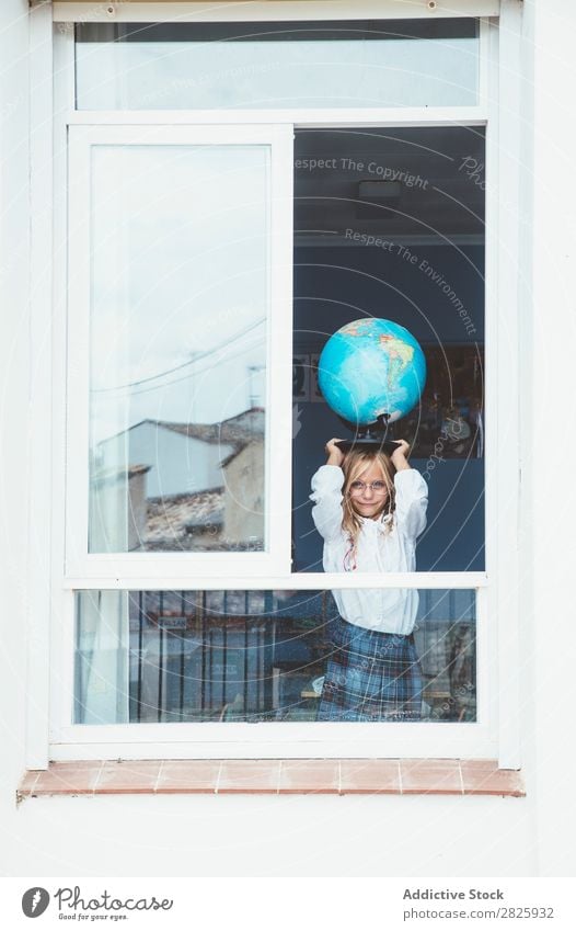 Schoolgirl posing with globe Girl Classroom Globe Window Map Posture Stand Cute Education Grade (school level) Student Youth (Young adults) Study Child Lessons