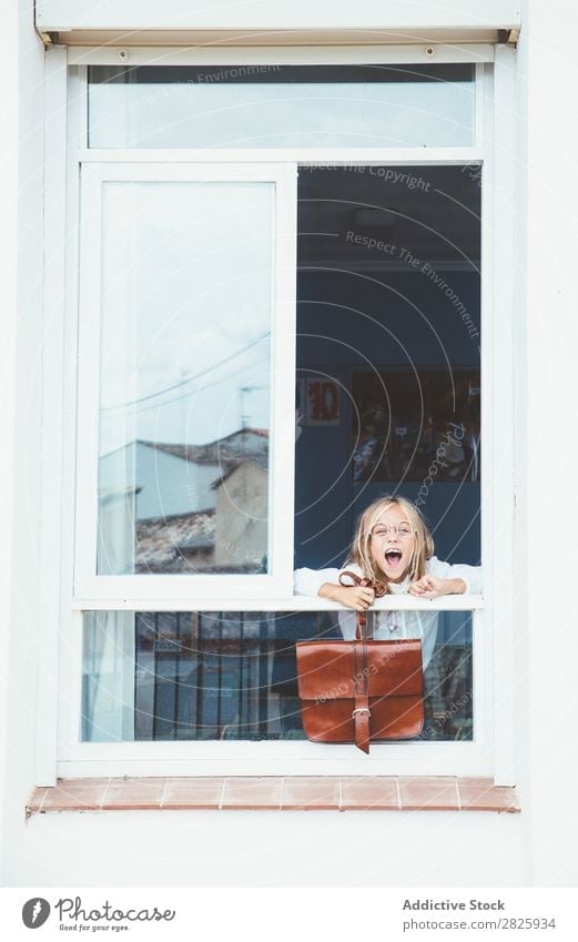 Schoolgirl posing with backpack in a window Girl Classroom Window Posture Stand Cute Education Grade (school level) Student Youth (Young adults) Study Child