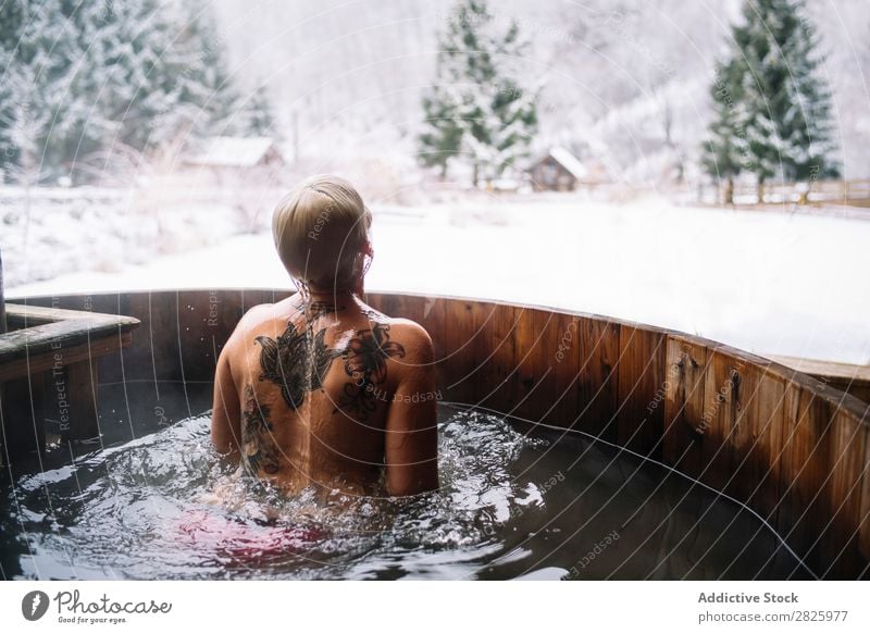 Woman swimming in outside tub Swimming Nature Winter plunge tub Water Healthy Beautiful Vacation & Travel Romania Float in the water Snow Ice Natural