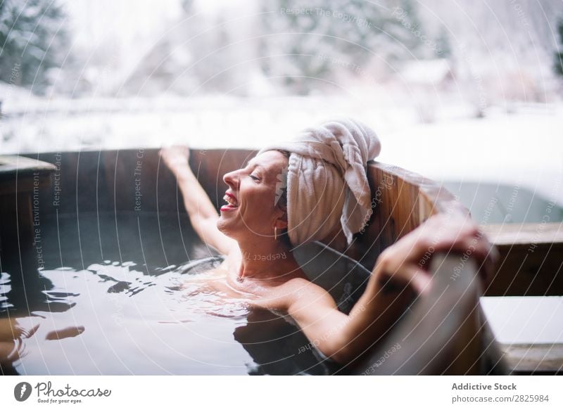 Cheerful topless woman in plunge tub Woman Swimming Nature Winter Lie (Untruth) Relaxation eyes closed Water Healthy Beautiful Vacation & Travel Romania