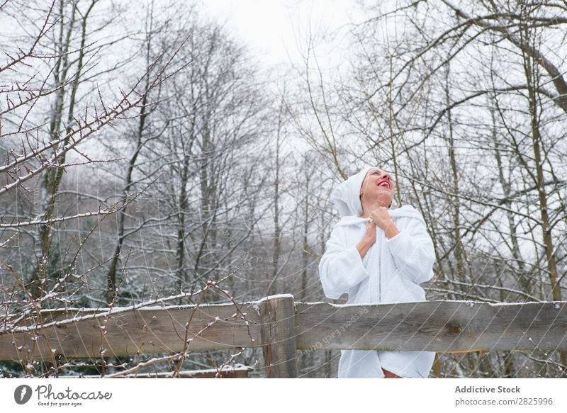 Cheerful woman in towel at river Woman Nature Winter Forest Healthy Bathrobe undressing Happy Towel Beautiful Vacation & Travel Romania Snow Ice Natural