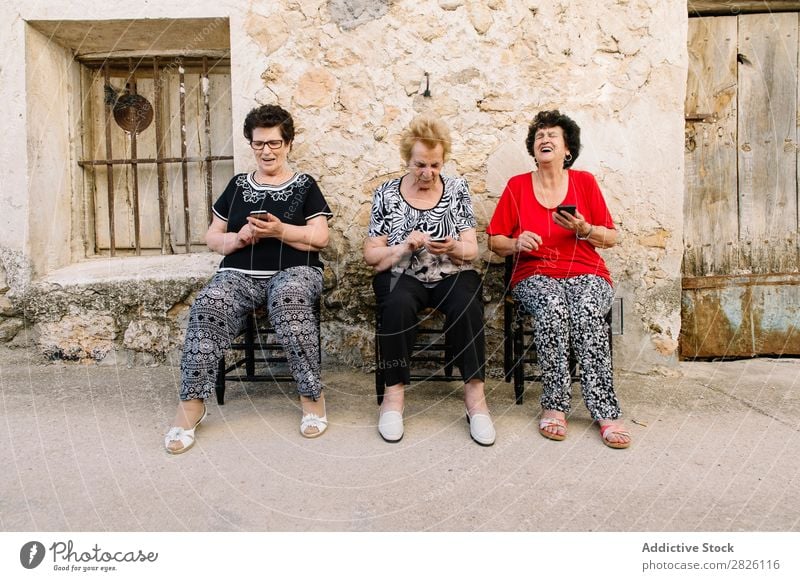 Three women of age advanced with smartphone Old Human being Telephone New Interlaced Lifestyle Mature Mobile Modern retired Retirement Touch Technology using