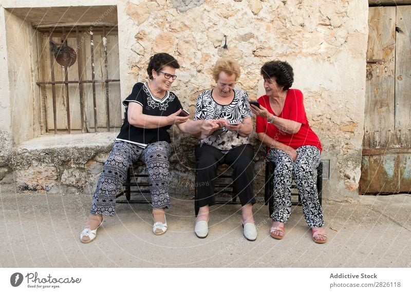 Three women of age advanced with smartphone Old Human being Telephone New Interlaced Lifestyle Mature Mobile Modern retired Retirement Touch Technology using