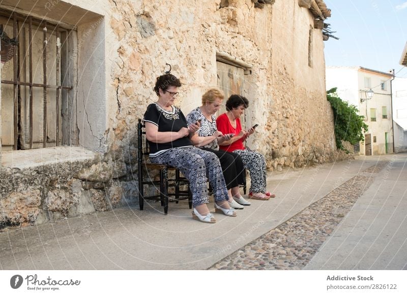 Three women of age advanced with smartphone Old Human being Telephone New Interlaced Lifestyle Mature Mobile Modern retired Retirement Touch Technology using