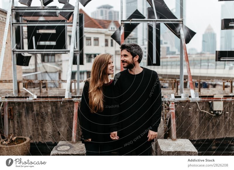 Happy couple on rooftop Couple Embrace City Love Vantage point Kissing romantic Together Beautiful Youth (Young adults) Man Woman Romance Relationship Happiness