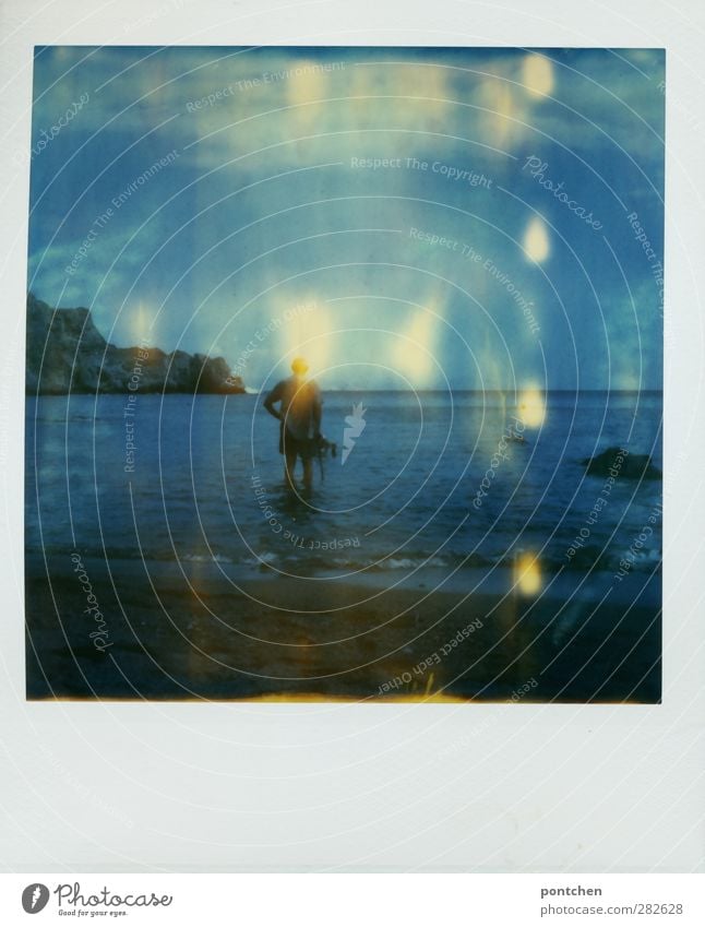 Older man stands ankle-deep in the sea. Vacation and recreation. Crete. Polaroid Man Adults 1 Human being Nature Beautiful weather Beach Ocean Stand Blue Rock