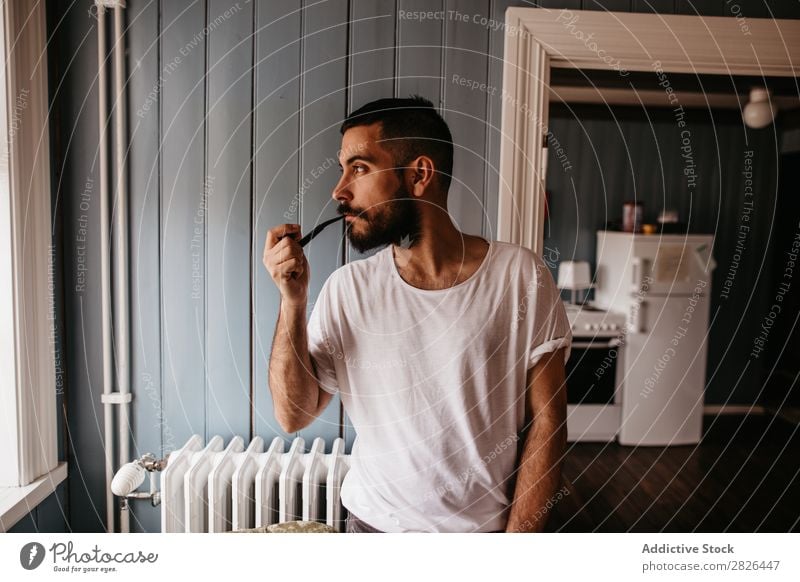 Man smoking pipe inside Pipe Hipster Style Adults House (Residential Structure) Iceland Tobacco Vintage Smoking bearded Posture Addiction Smoke Elegant