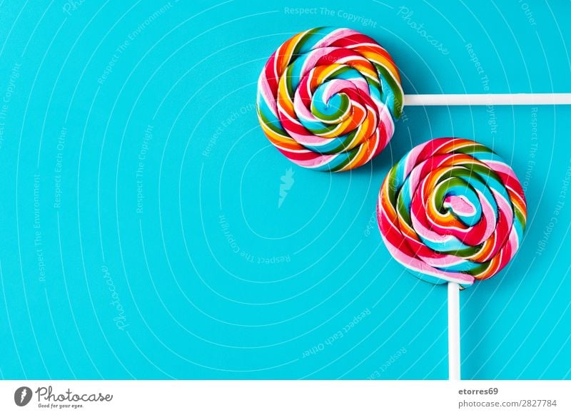 Colorful lollipops on blue background. Top view. Copyspace Lollipop Colour Multicoloured Sugar Candy Sweet Tasty Copy Space Food Food photograph Healthy Eating