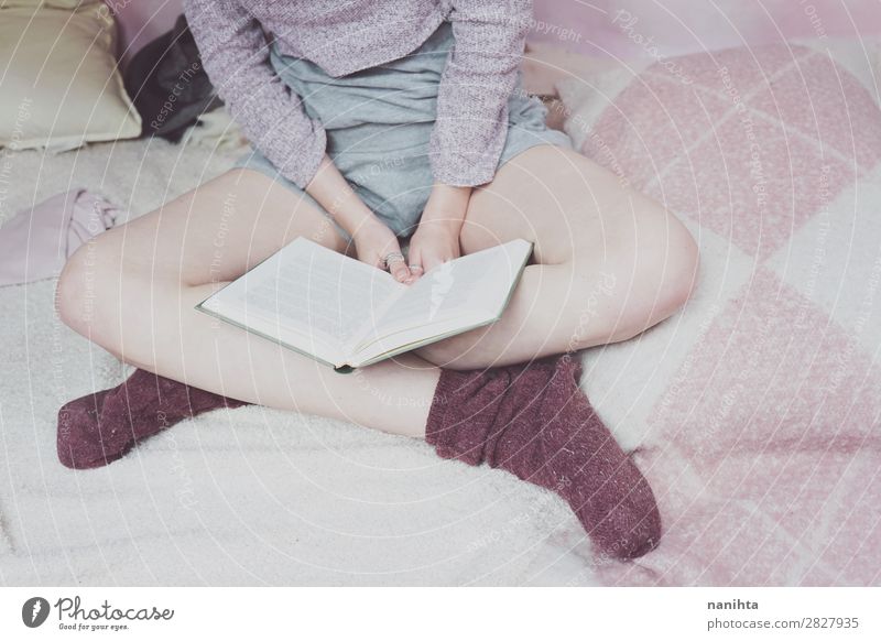 Young woman reading in her bedroom Lifestyle Relaxation Calm Leisure and hobbies Reading Bedroom Education Study Student Feminine Youth (Young adults) Woman