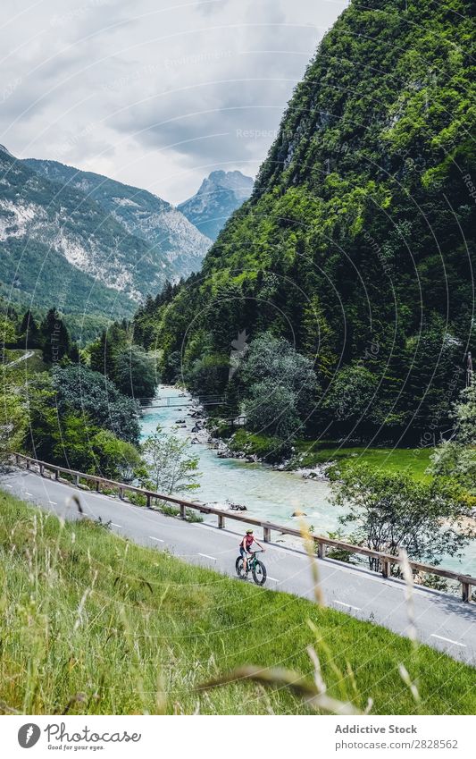 Person riding mountain bike Human being Bicycle Mountain Street Sports Nature Practice Cycling Adventure Motorcycling Lifestyle Relaxation Ride Cycle Action