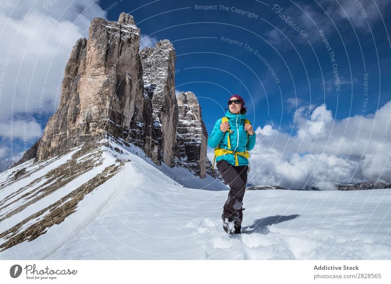 Woman tourist in mountains Snow Mountain Tourist Backpack Looking away Vacation & Travel Winter Hiking Adventure Landscape Nature trekking Extreme hiker