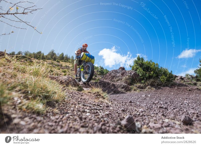 Man riding downhill Tourist Ski-run Ride Sports Vacation & Travel Action Adventure Tourism Mountain Extreme Street Motorcycling Bicycle Nature Cycle Relaxation