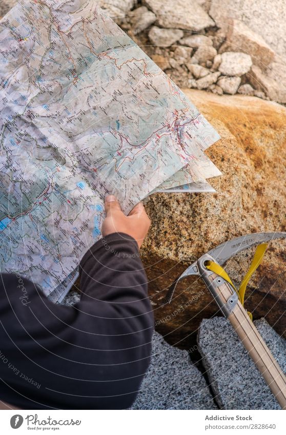 Tourist with map on stone Map navigating Stone Axe ice-axe Vacation & Travel Nature Trip Adventure Navigation Tourism Hiking Rock Direction Mountain Lifestyle
