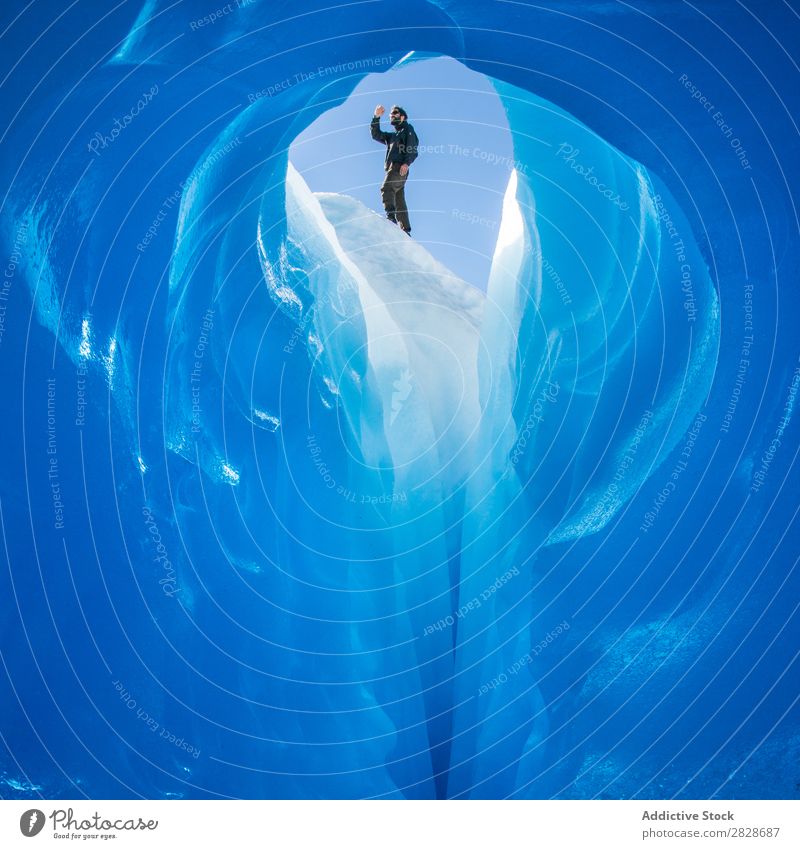 Person on top of ice cave Tourist Glacier Cave Ice Landscape Crystal Tourism Interior shot Natural Attraction Cold The Arctic Extreme Adventure Entrance Freeze