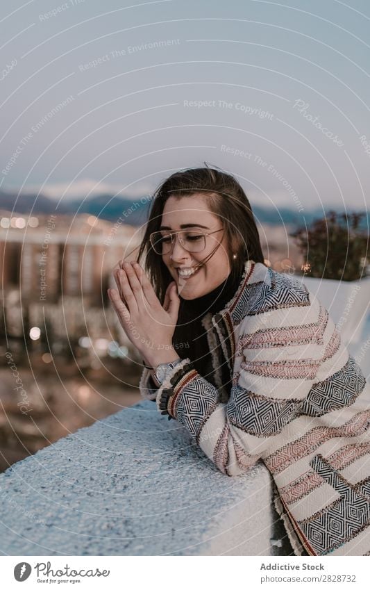 Cheerful young woman leaning on fence Woman pretty Youth (Young adults) Beautiful Fence Lean Town Street Smiling Person wearing glasses Brunette Attractive