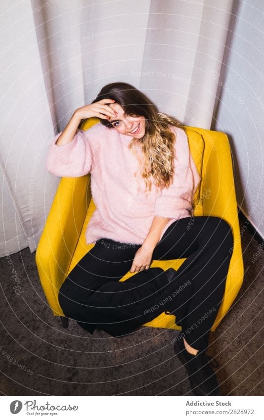 Young woman resting on armchair Woman Youth (Young adults) Attractive Home Sweater Pink Armchair Sit Lie (Untruth) Happy Expressive Posture Alluring Beautiful
