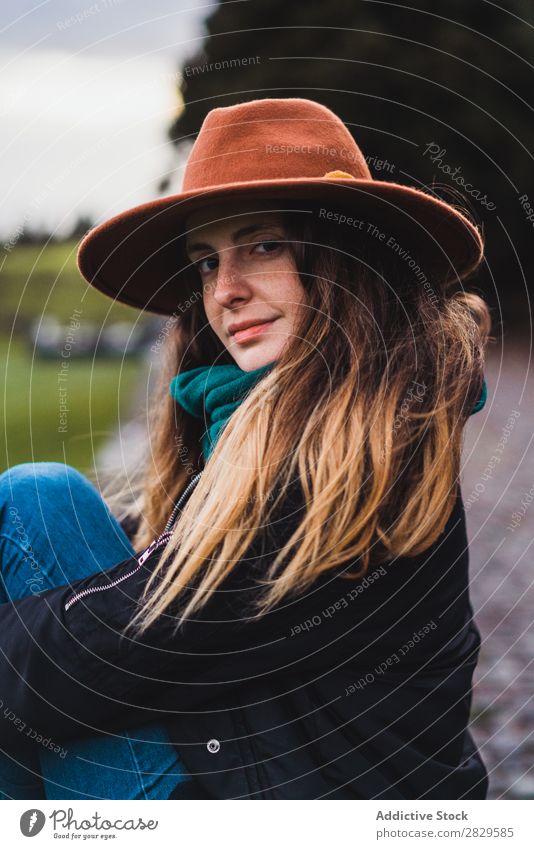 Woman sitting on fence at field Sit Field Green Nature Meadow Fence Relaxation Rest Hat Spring Summer Grass Landscape Agriculture Rural Sunlight Farm Beautiful