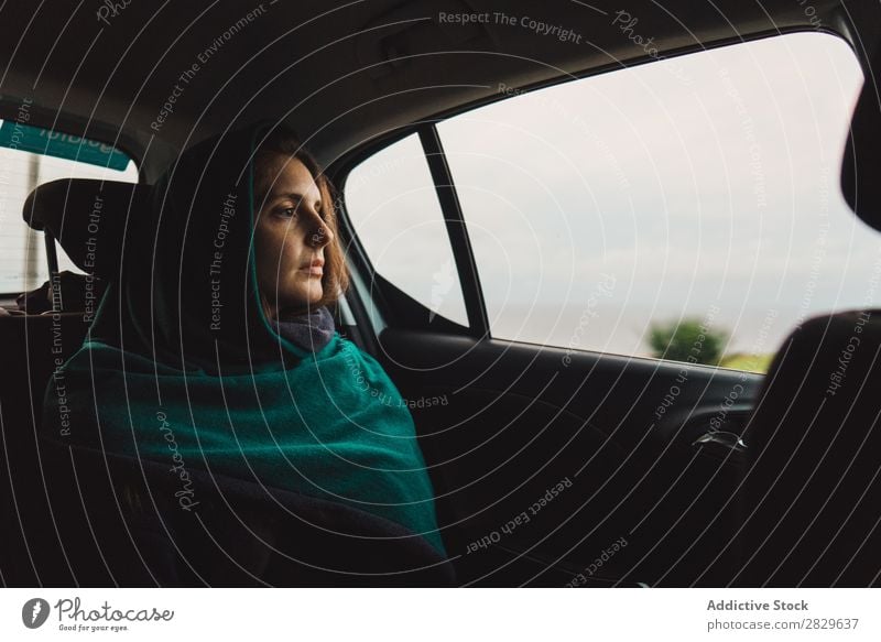 Woman riding in car looking away Car Dream Vacation & Travel Traveling contemplate Inspiration Sadness Interior shot Window Relaxation traveler backseat