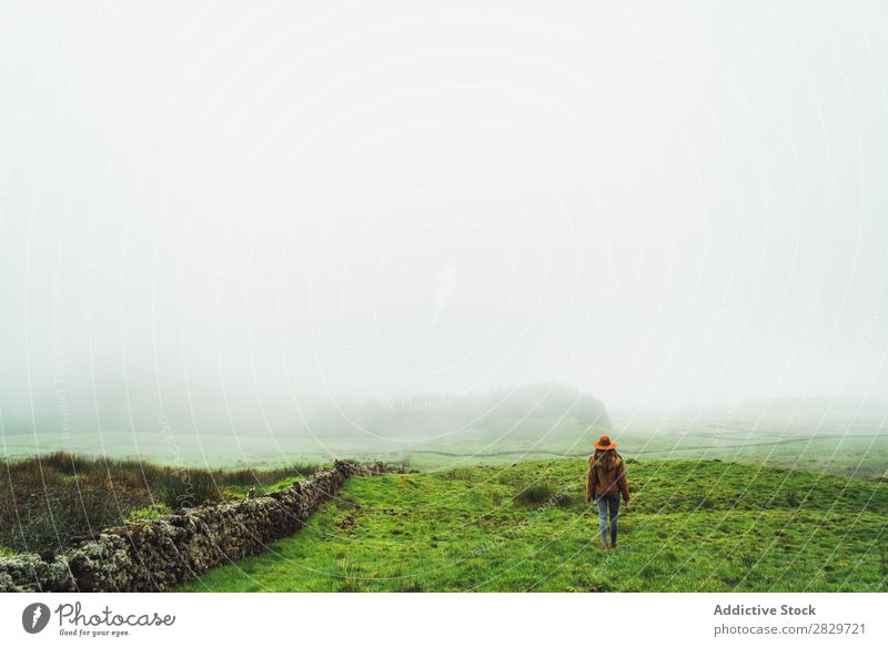 Content woman in green foggy fields Woman Fog Grassland Cold Freedom Vacation & Travel Wilderness enjoyment Weather Joie de vivre (Vitality) Peaceful Rural