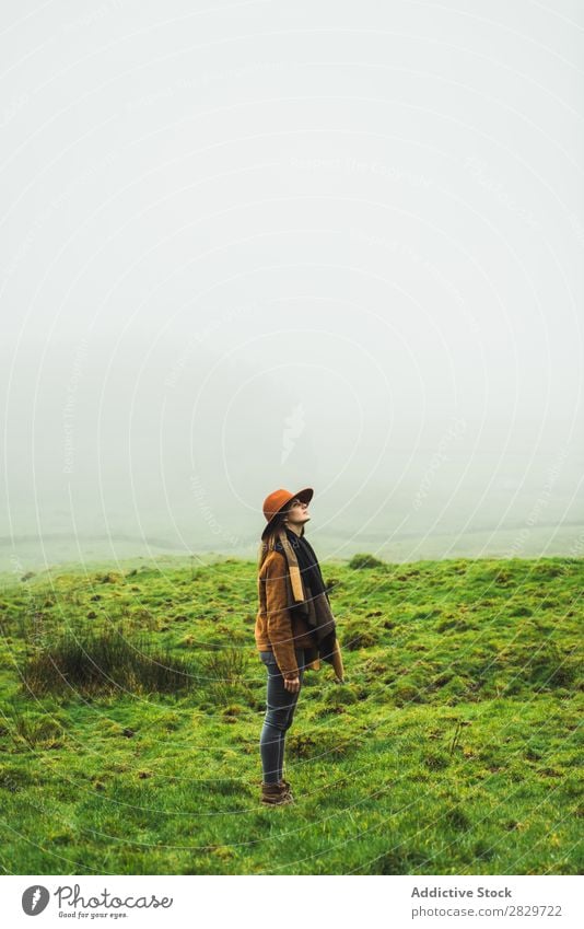 Content woman in green foggy fields Woman Fog Grassland Cold Freedom Vacation & Travel Wilderness enjoyment Weather Joie de vivre (Vitality) Peaceful Rural