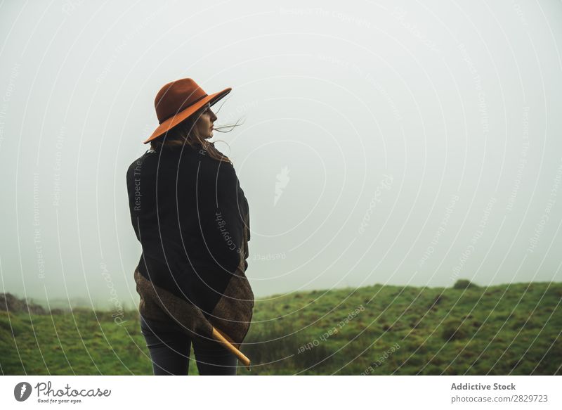 Woman in green foggy fields Fog Grassland Cold Freedom Vacation & Travel Wilderness enjoyment Weather Joie de vivre (Vitality) Peaceful Rural tranquil Jacket