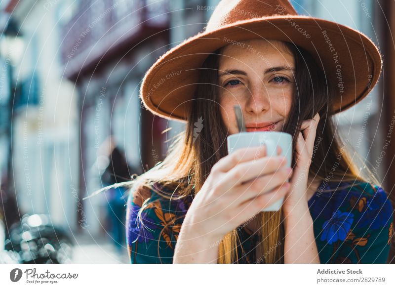 Smiling woman with cup in outside cafe Woman pretty Style Street Hat Coffee Cup Café Exterior shot Fashion Beautiful Youth (Young adults) Portrait photograph