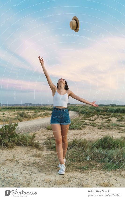 Woman throwing up hat in nature Field pretty throw up Hat Beautiful Girl Nature Beauty Photography Youth (Young adults) Summer Happy Portrait photograph Sand