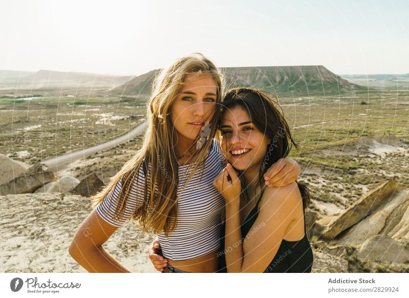 Happy women walking on hill Woman Cliff Excitement Freedom Vacation & Travel Success Top Mountain Youth (Young adults) Nature Rock Landscape Adventure Peak