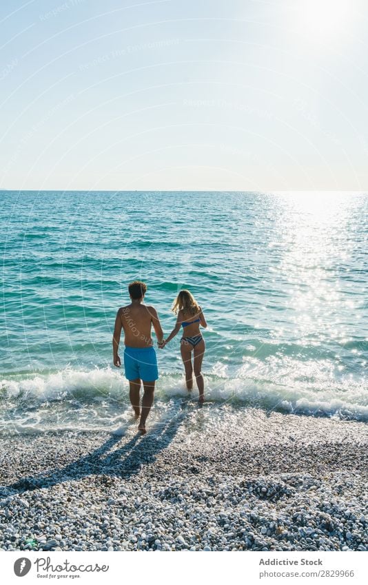 Couple posing in ocean water Ocean Swimming Summer Exotic romantic Water Love Tropical Beauty Photography enjoyment Sun Vacation & Travel Honeymoon Paradise