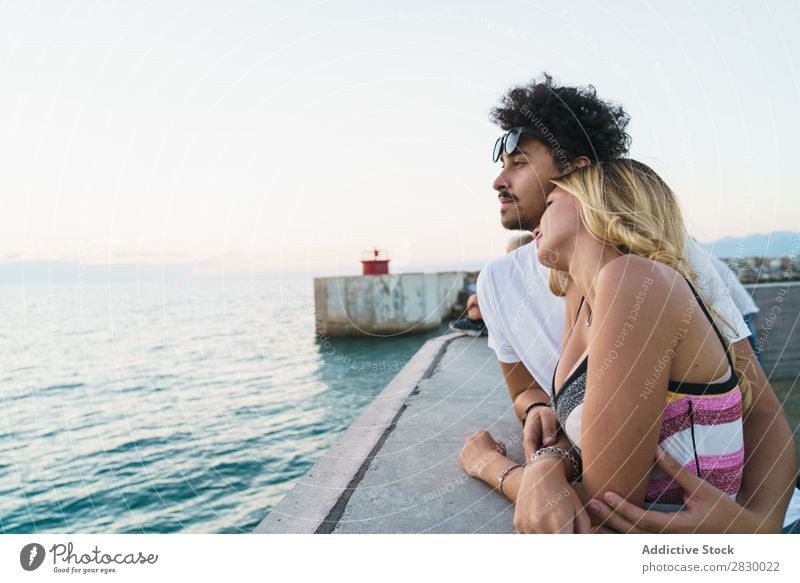 Gentle couple enjoying ocean view Couple Jetty Ocean embracing Relaxation Resort romantic Vacation & Travel Summer Together Nature Leisure and hobbies Love