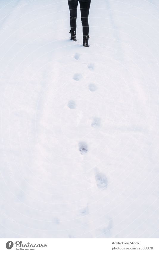 Crop woman walking on snow Woman Street Walking Snow Steps fashionable To enjoy Youth (Young adults) pretty Winter Cold Cool (slang) Fashion Style warm clothes