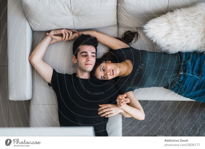 Couple lying on couch Home Together embracing Sofa Couch Cozy Human being Happy Love House (Residential Structure) Man Woman Lifestyle 2 Youth (Young adults)