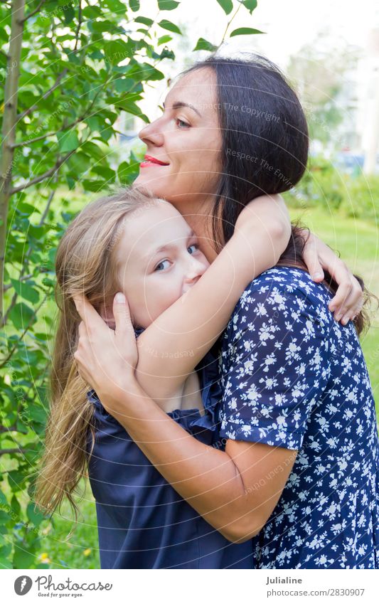 Kissing mother and daughter in summer Summer Child Schoolchild Woman Adults Parents Mother Infancy 18 - 30 years Youth (Young adults) Brunette Blonde Smiling