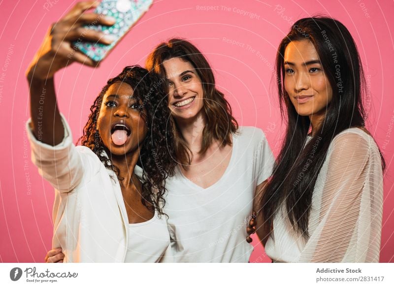 Women taking selfie in studio Woman pretty Portrait photograph Youth (Young adults) Friendship Selfie PDA Black asian diversity multiethnic Mixed race ethnicity