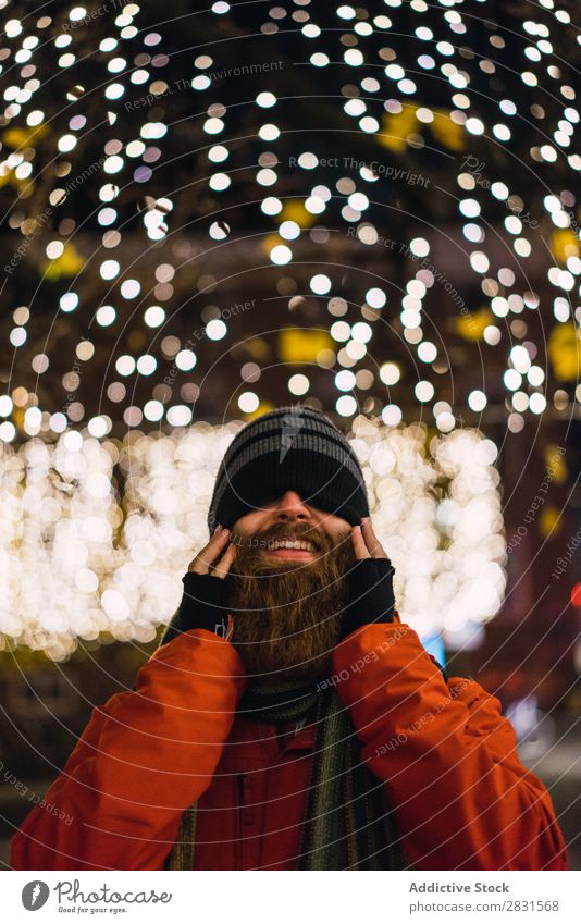 Handsome man posing at lights Man handsome City Smiling Cheerful Illumination Beard Hat Street Youth (Young adults) Town Lifestyle Easygoing Fashion Style