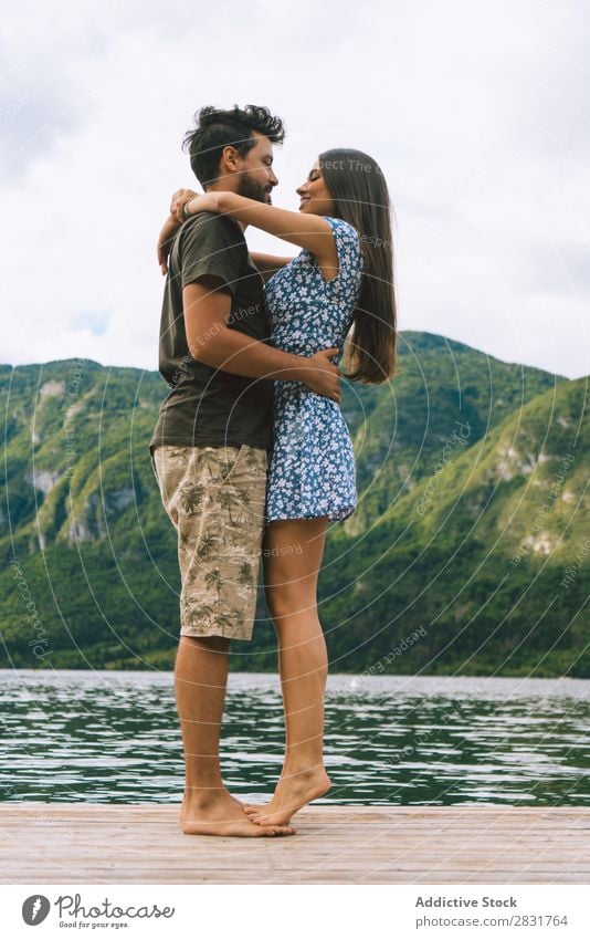 Couple posing on pier Jetty Joy Lake Mountain Happy Love Together Nature Summer Water Youth (Young adults) Woman Vacation & Travel Lifestyle Human being