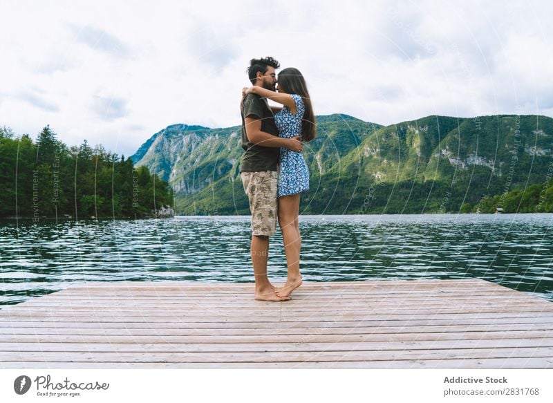 Couple posing on pier Jetty Joy Lake Mountain Happy Love Together Nature Summer Water Youth (Young adults) Woman Vacation & Travel Lifestyle Human being