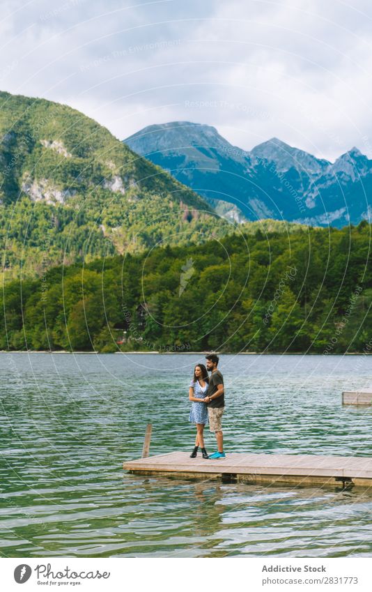 Couple posing on pier Jetty Joy Lake Mountain Happy Love Together Nature Summer Water Youth (Young adults) Woman Vacation & Travel Lifestyle Human being